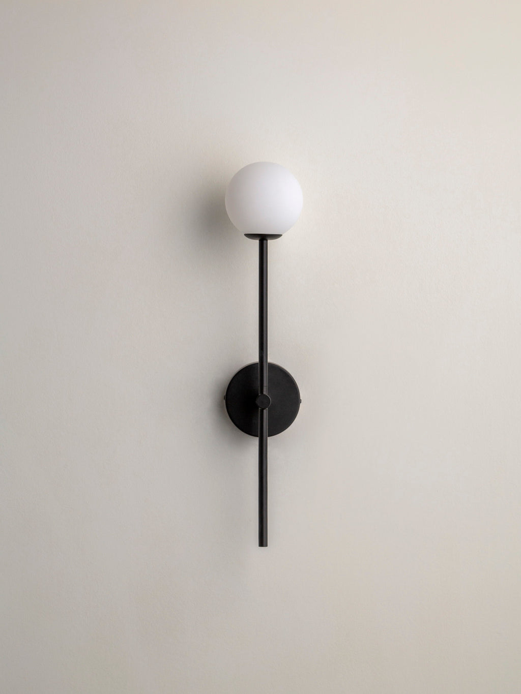 Chelvara - matt black and opal wall light